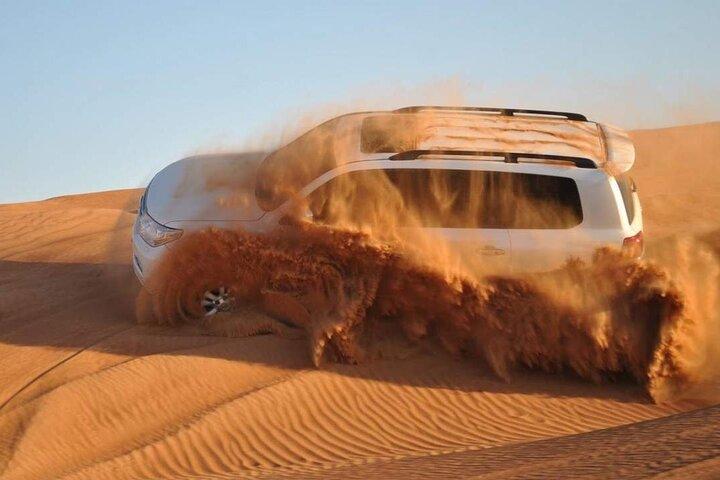 Dubai Desert Safari with BBQ dinner and camel ride - cover photo